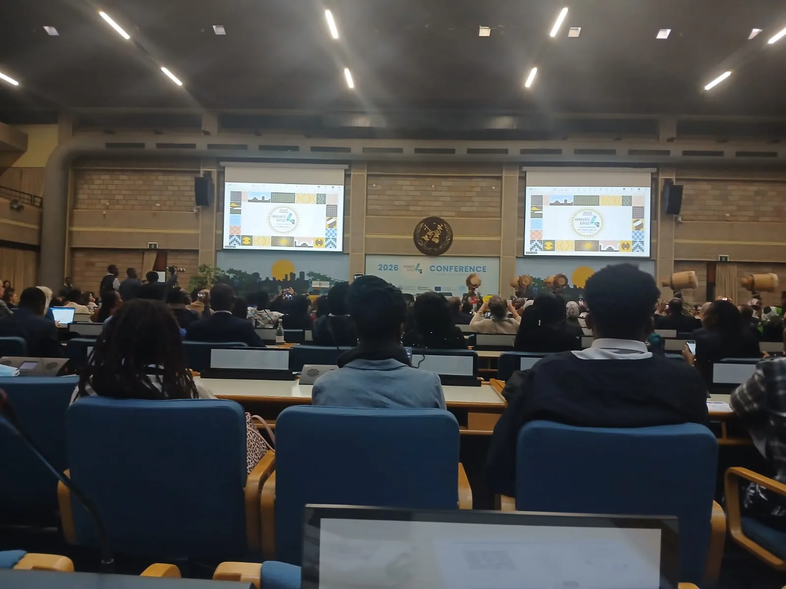 Delegates in a plenary hall during a corporate sustainability conference